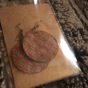 Homemade wooden earrings in matte red